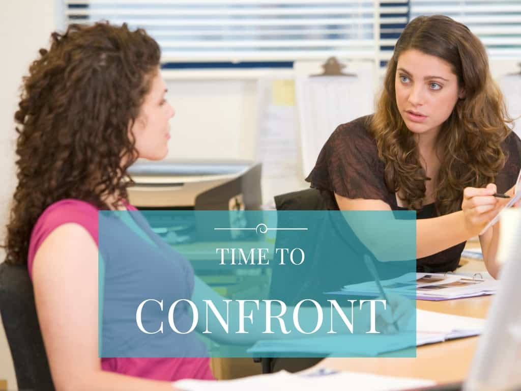 Two friends discussing something in a workplace environment. Quote says, "Time to confront"