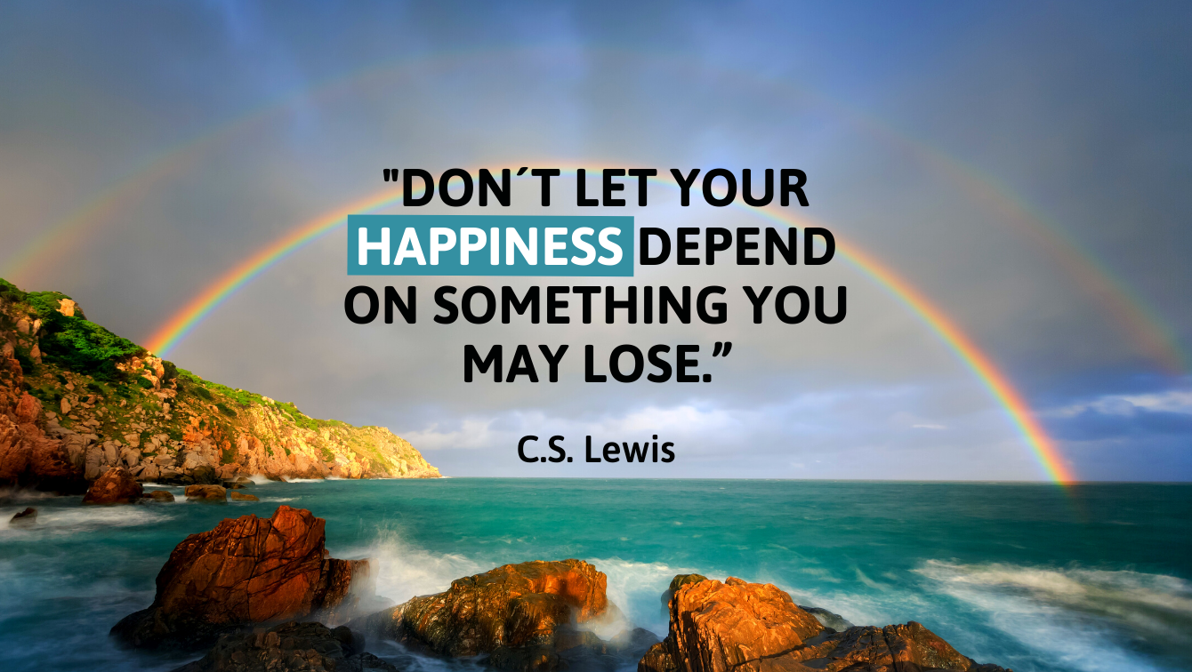 A photo of a rainbow going from an island into the ocean and a quote by C.S. Lewis that reads, "Don't let your happiness depend on something you may lose"